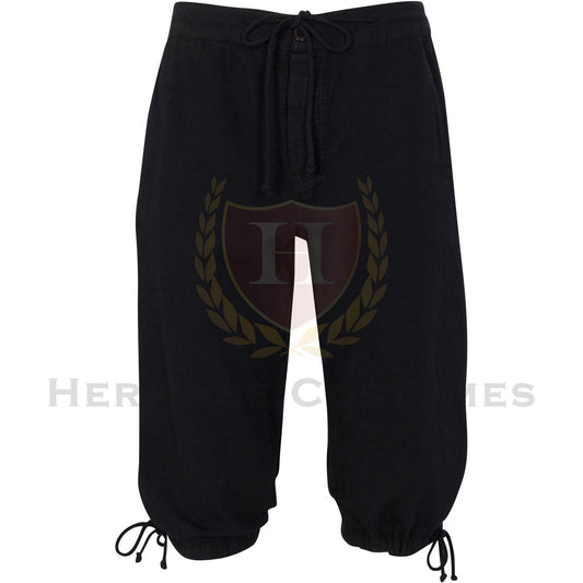 Front view of black linen pirate breeches featuring a drawstring waist, button closure, and adjustable leg ties. Perfect for historical reenactments, cosplay, and pirate-themed costumes.