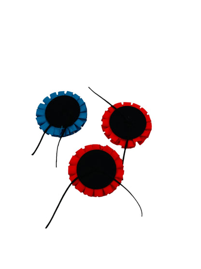 Back view of a Tricolor Colonial Hat Cockade, showcasing the secure leather string tie-back for easy attachment to tricorn hats, with detailed craftsmanship in red, white, and blue pleated ribbons.